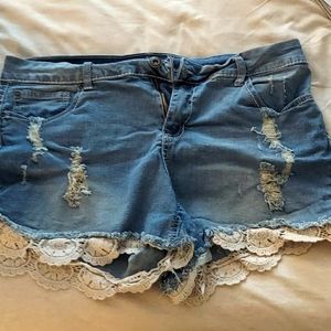 Lace trim distressed jean shorts